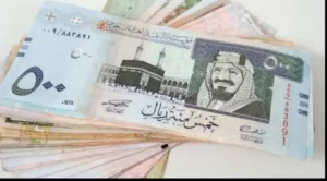 Interpretation of a dream about someone giving me 500 riyals to a divorced woman